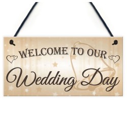 Houten bord aan touw met de tekst Welcome to our Wedding